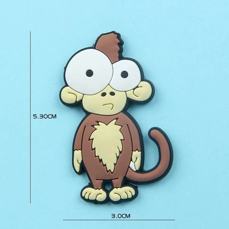 Set of 9 colourful PVC cartoon animal refrigerator stickers on a white fridge surface