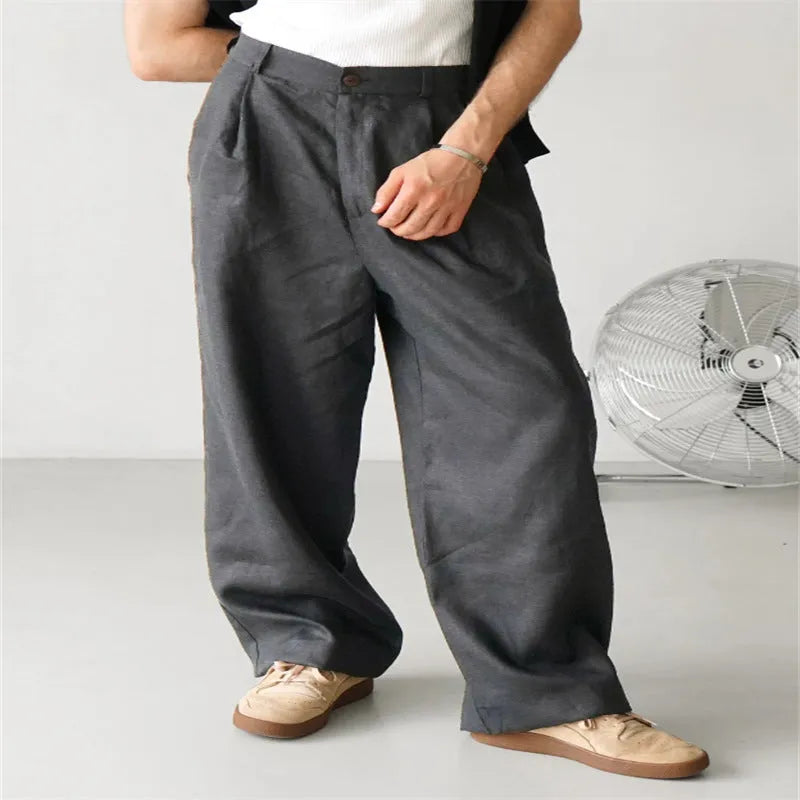 Men's loose high-waist linen jogger pants in a straight-leg cut, shown in a neutral colour.