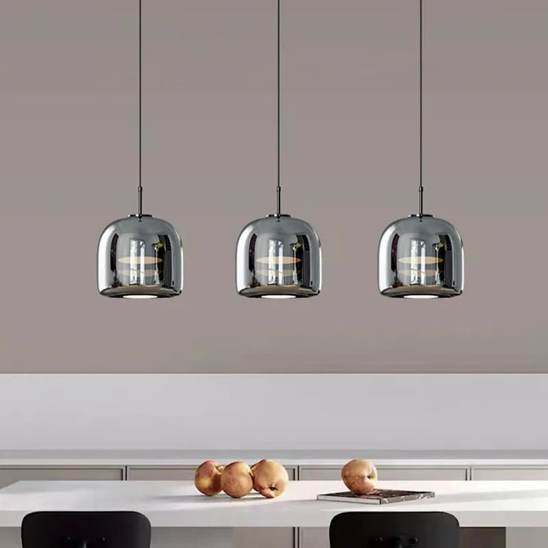 Italian minimalist glass chandelier with tricolor light in a dining room setting