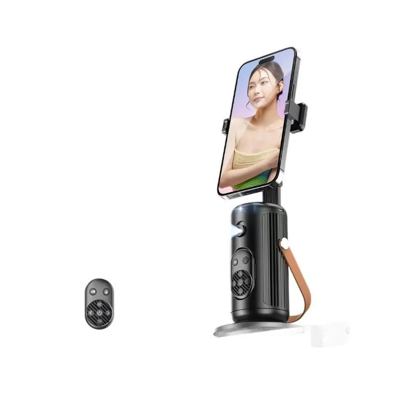 Smart AI face recognition selfie holder with Bluetooth remote on a desk, showing 360-degree rotation feature