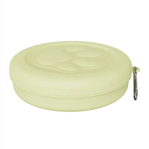 Portable plastic dog feeding bowl with integrated snack box compartment in light green colour