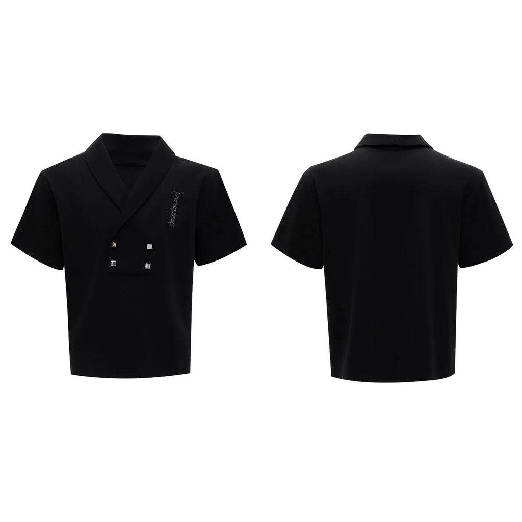 Men's dark grey cotton sports suit with V-neck top featuring padded shoulders and metal embellishments, paired with matching shorts.