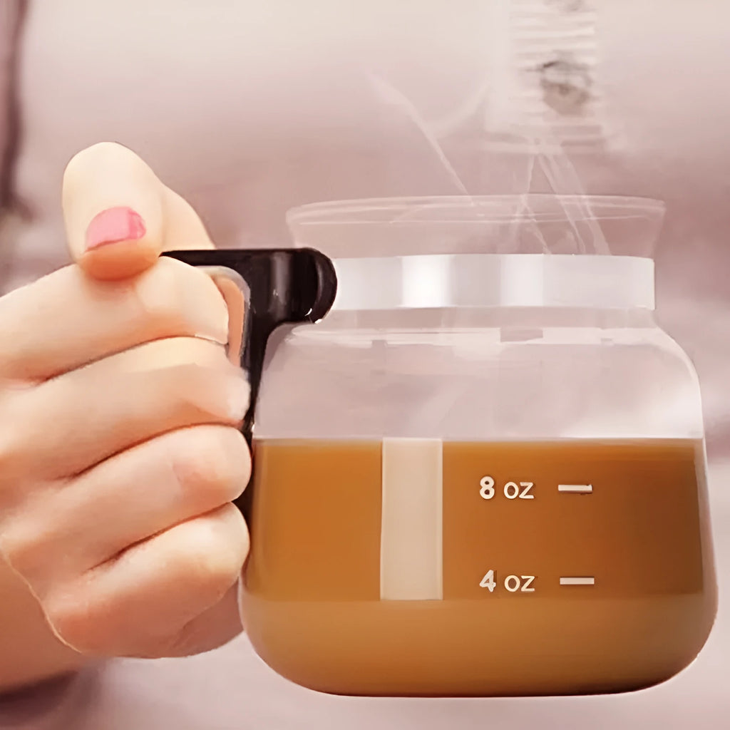 Transparent borosilicate glass coffee maker with silicone cover on a kitchen countertop, 355-473ml capacity