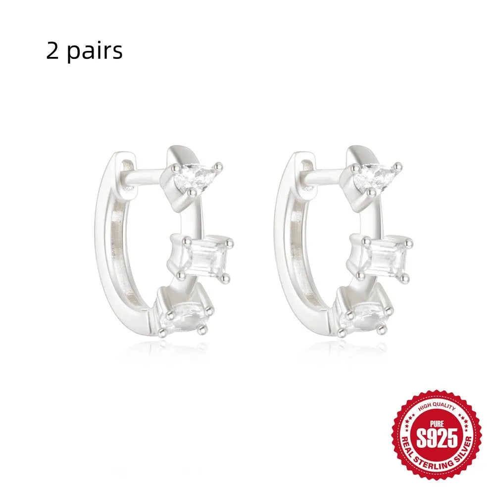 Small round geometric sterling silver stud earrings with diamond accents in gold or silver finish