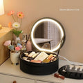 Round smart LED makeup bag with integrated mirror lights in cherry blossom pink colour with lattice partitions visible