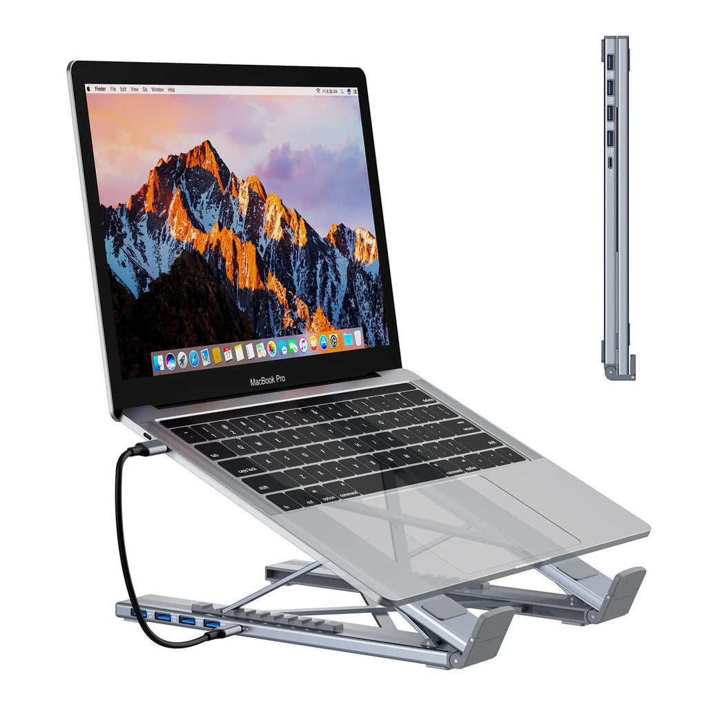 Grey aluminium alloy laptop docking station with folding stand and multiple ports