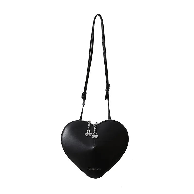Women's heart-shaped PU crossbody bag in milky white with single shoulder strap and sandwich pocket