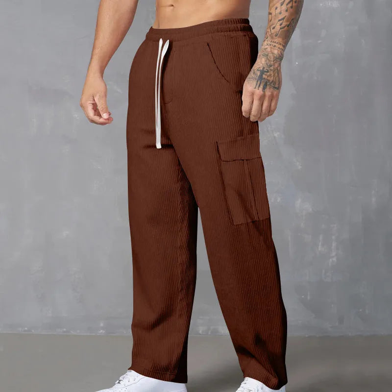Men's loose-fitting corduroy cargo trousers in a straight-leg cut, shown in a solid colour.