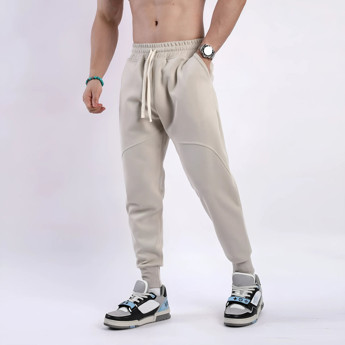 Men's ankle-tied drawstring sweatpants in polyester cotton, available in five colours and sizes M to XXXL