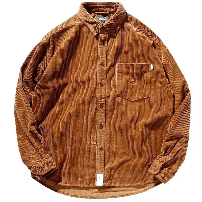 Man wearing a loose caramel coloured corduroy cardigan shirt in Hong Kong style.