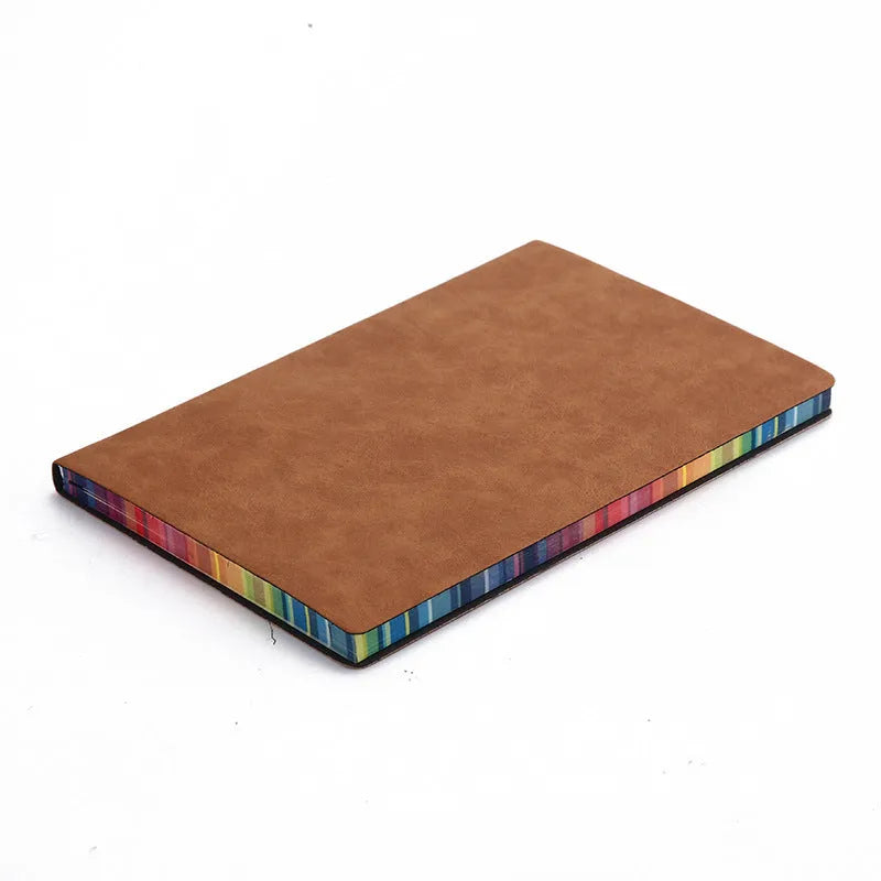 A5 rainbow side PU leather cover notebook open on a desk, showing lock line hardcover binding and 100g Daolin paper pages