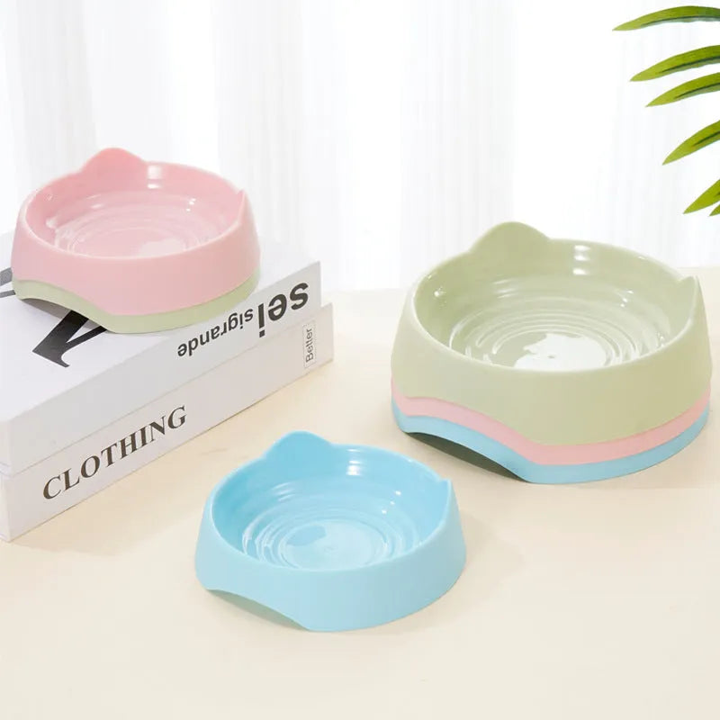 Ceramic dog slow feeder bowl with puzzle maze design in blue, green and pink colours showing S and L size options