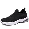 A pair of low-top slip-on sock shoes with a mesh upper and PVC sole on a plain background.