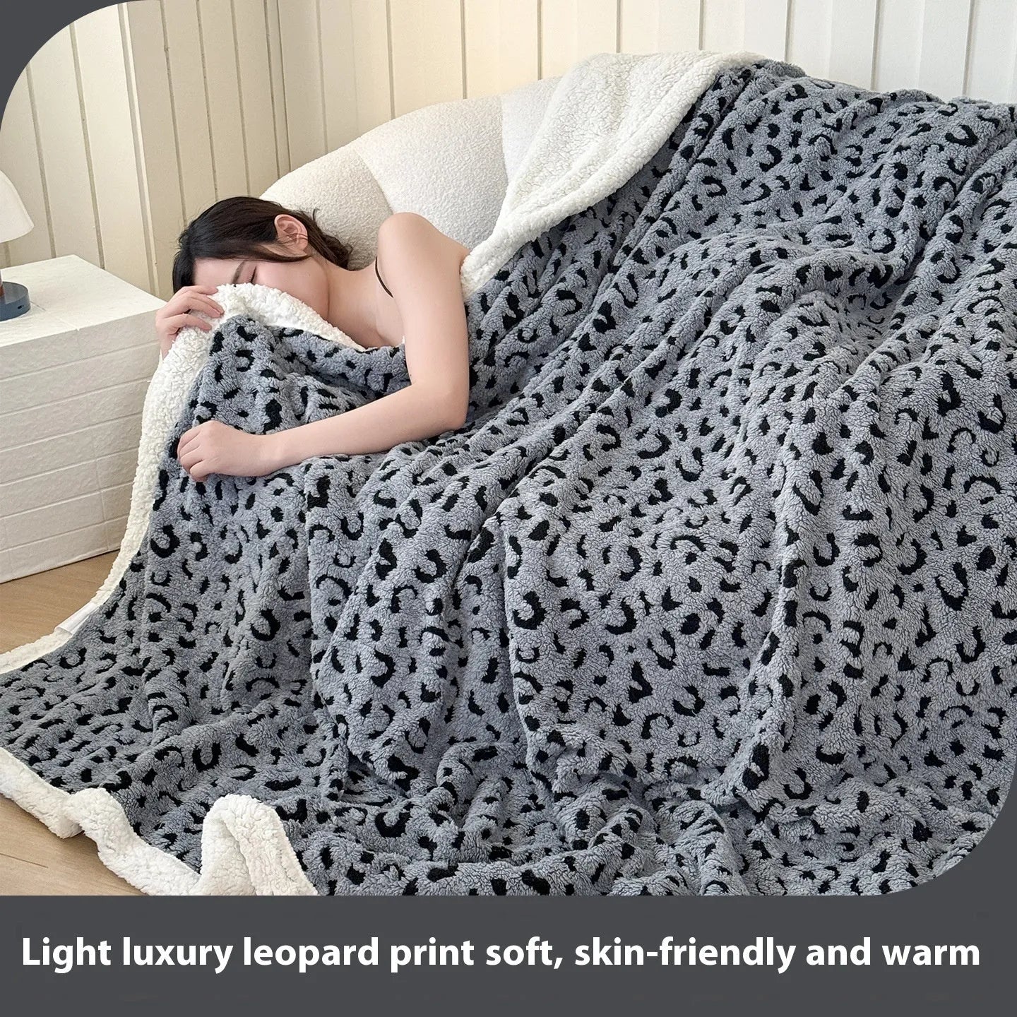 Double-layer taffeta blanket with woven leopard print pattern draped over sofa