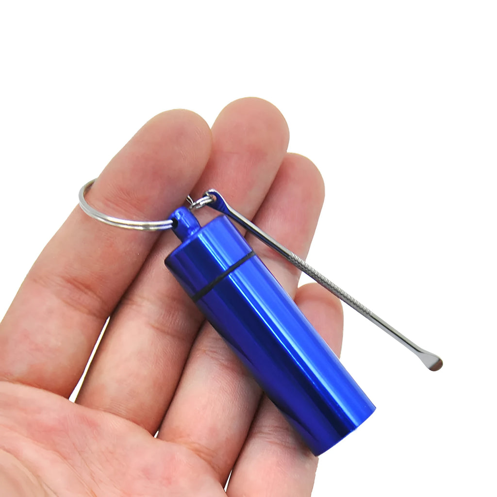 Blue aluminium portable medicine bottle with attached spoon and keychain for medication organisation