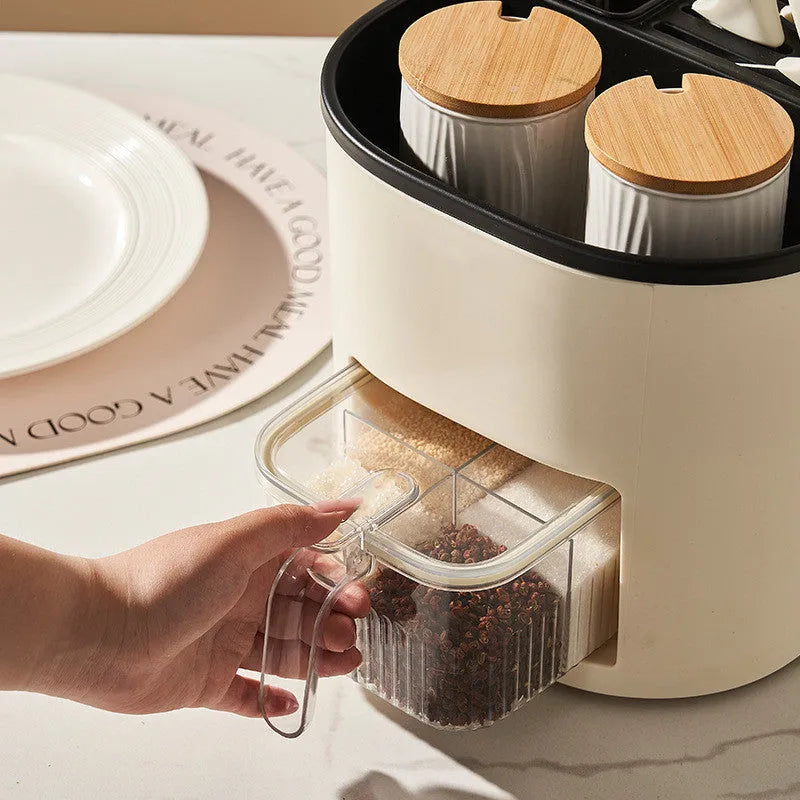 Rotating kitchen storage organiser with spice box compartments on countertop