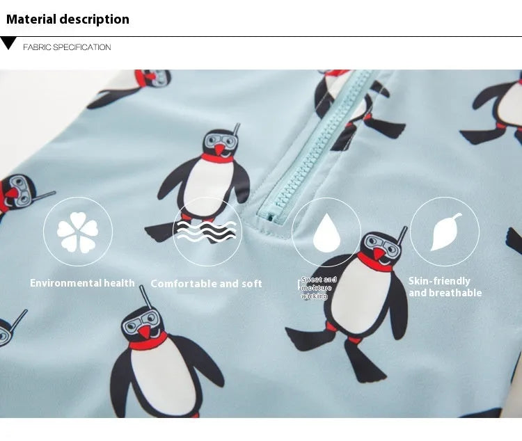 Boys' blue and white penguin print long sleeve swimsuit with matching swimming cap laid flat.