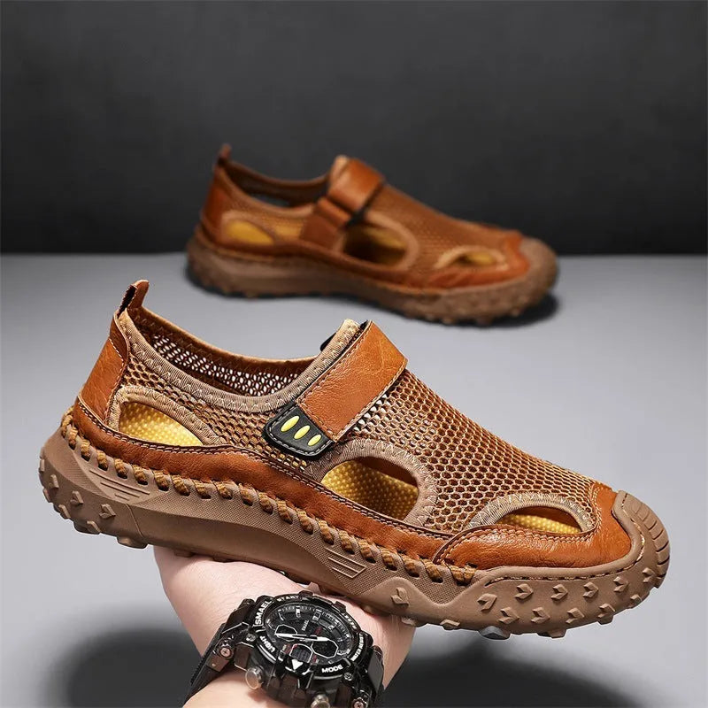 Men's black casual sandals with mesh upper and velcro straps on a rubber sole.