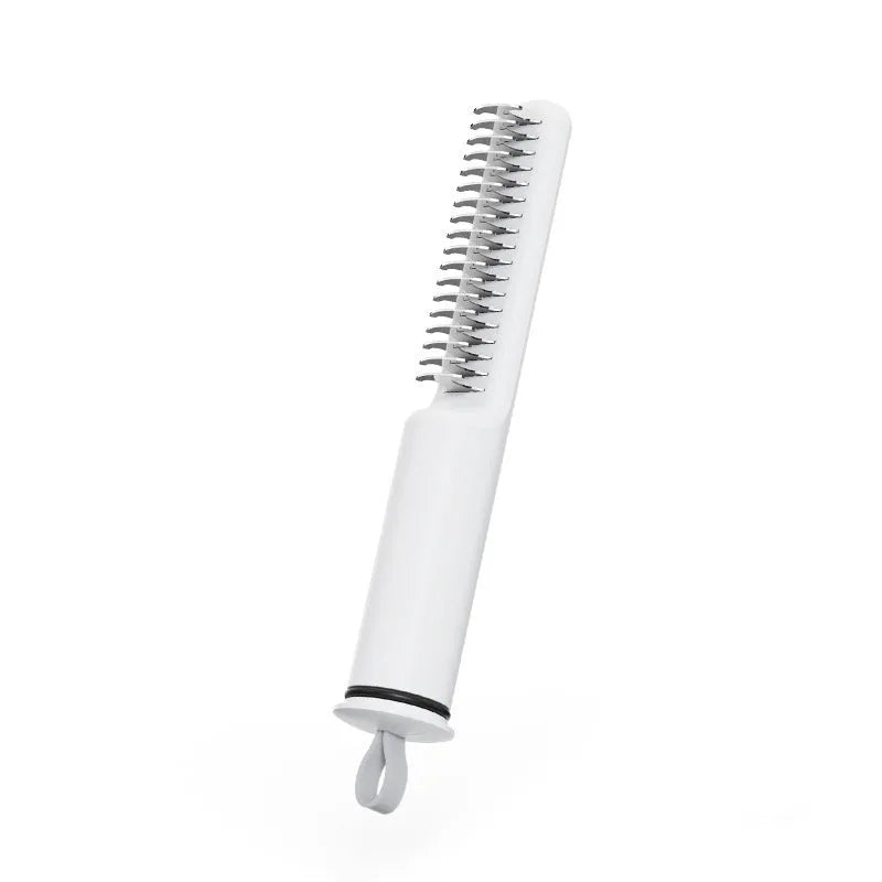 Stainless steel dematting comb with ergonomic handle for removing knots from dog or cat hair.