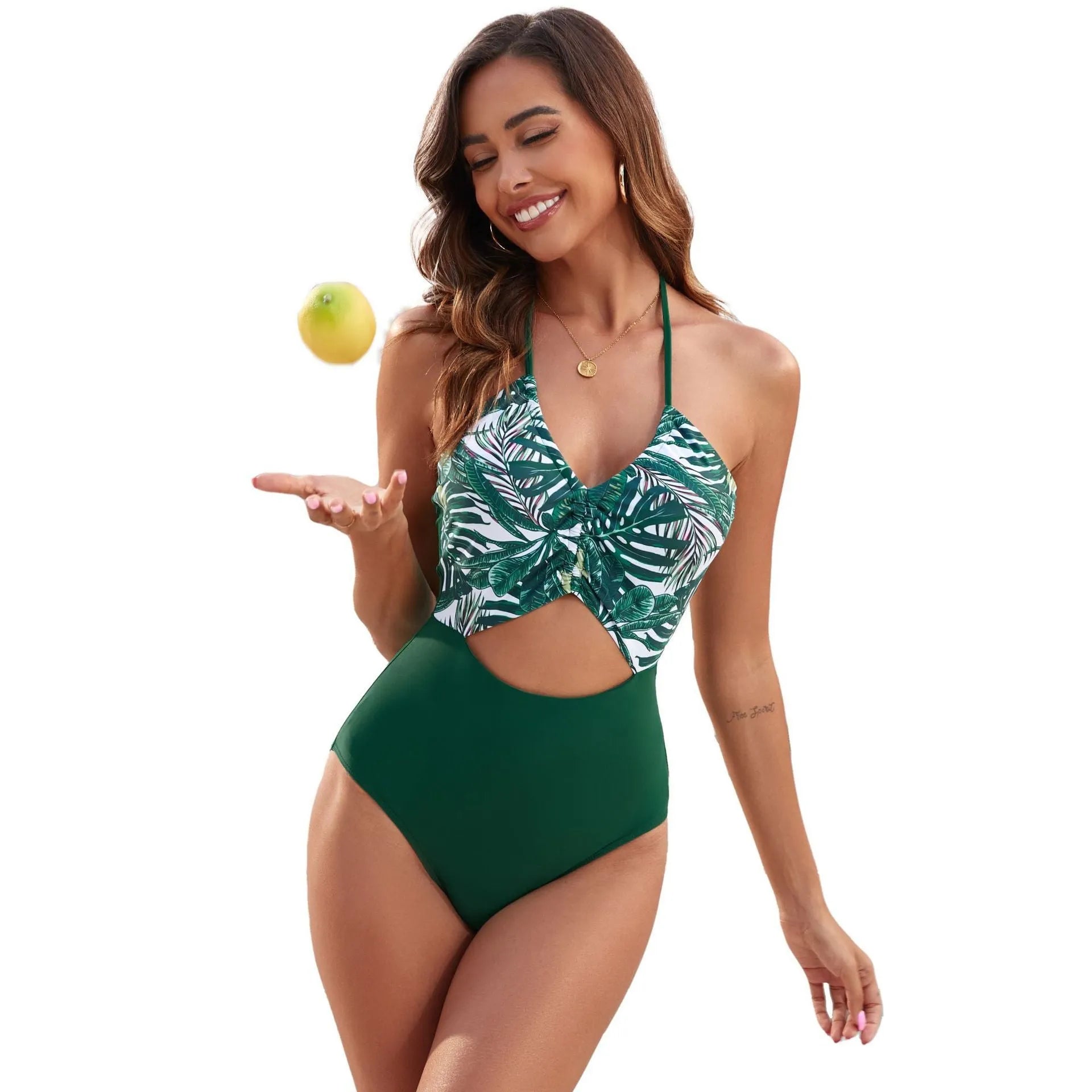 Women's black one-piece swimsuit with a colourful patchwork leaf print pattern