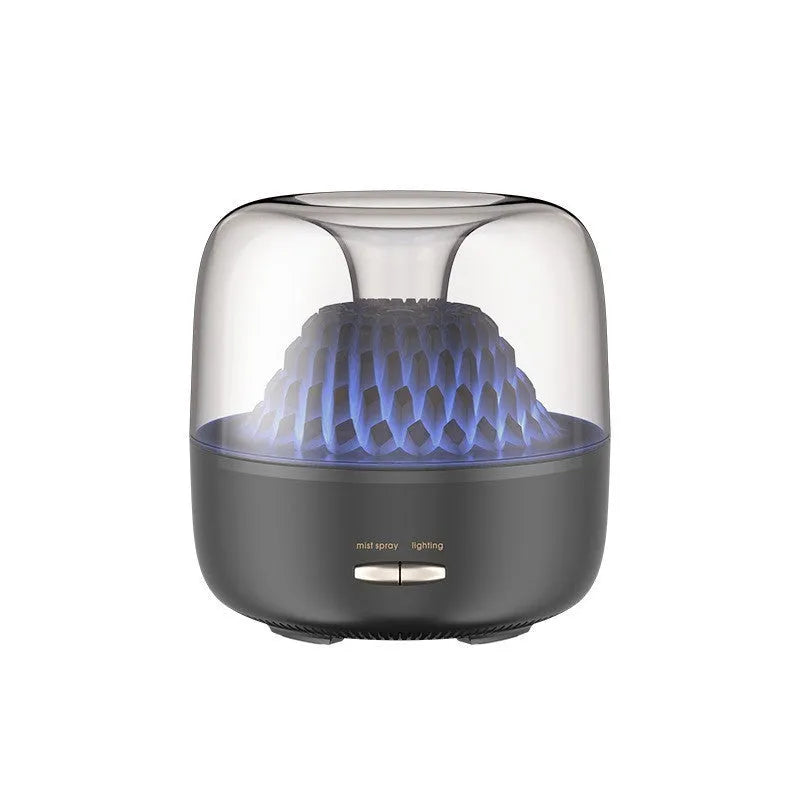 Round beige resin aroma diffuser with one fog outlet and colourful light on a desktop