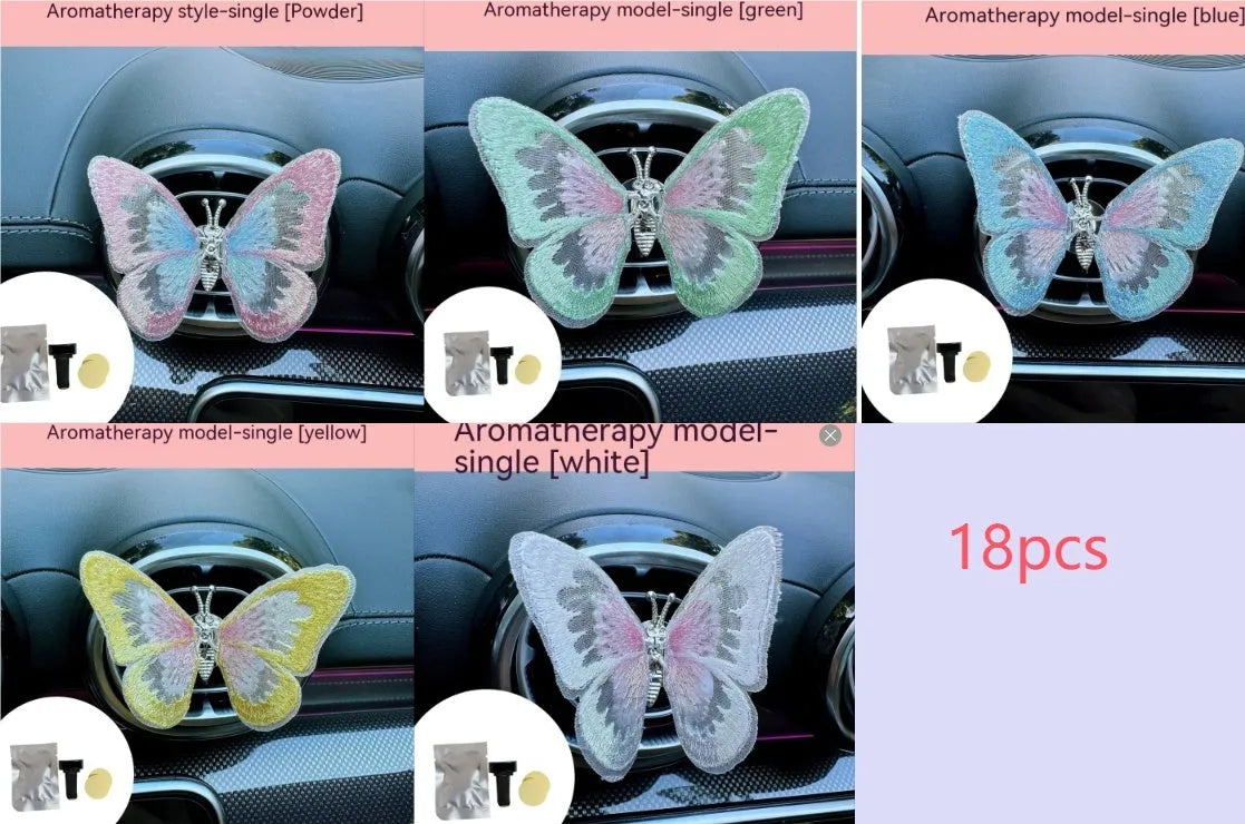 Fabric embroidered butterfly car air vent decoration in multiple colour options on a dashboard.
