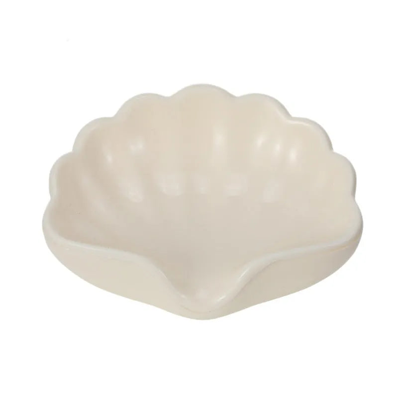 Shell-shaped plastic soap dish in pearl white or cherry blossom pink for bathroom storage