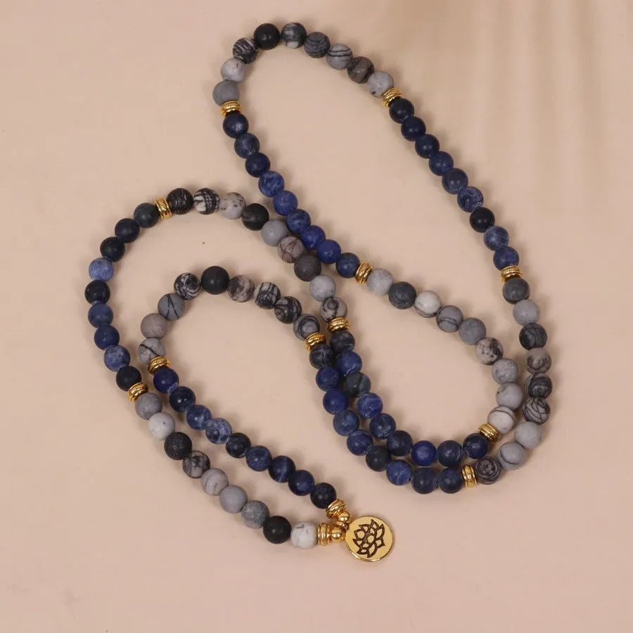 Blue multi-layer bracelet with patterned network stone beads on wrist