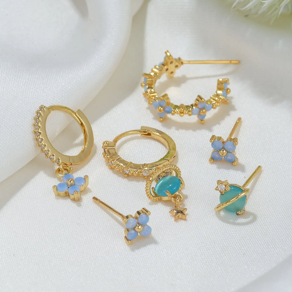 Blue protein colour flower nail design earrings with zircon accents in gold and silver options