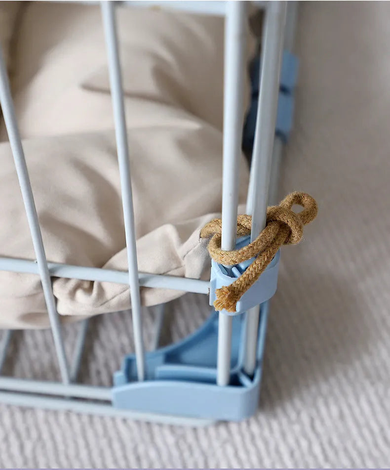 Beige pet cage cushion secured inside a metal dog crate, showing tie straps.