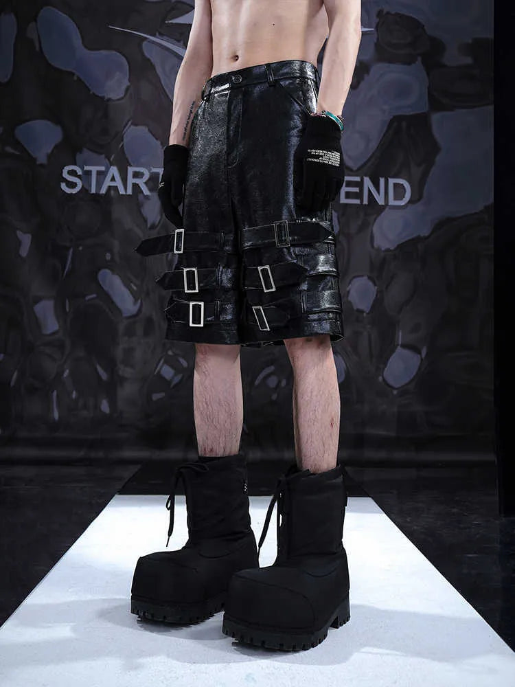 Men's black PU leather casual cropped pants with a medium-low waist on a model.