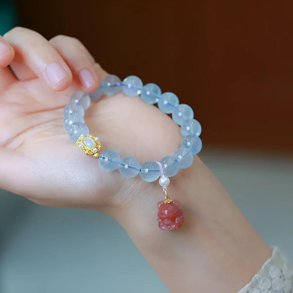 Aquamarine gemstone and components for a DIY Fengjiu Chinese style bracelet kit for women.