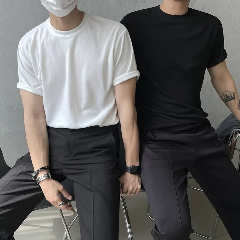 Slim fit men's cotton T-shirt in black on a white background, showing round neck and short sleeves.