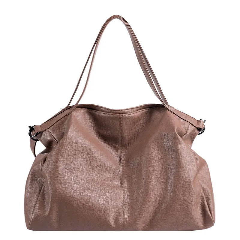 Soft surface messenger shoulder bag in horizontal square shape with zipper opening and internal compartments