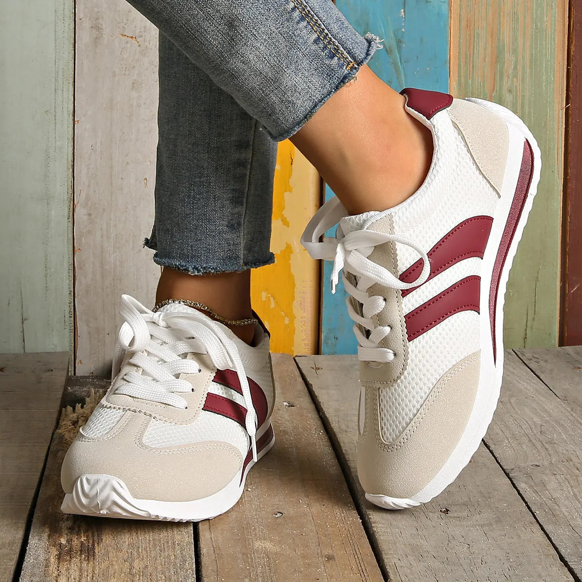 Women's wine red Cortez sneaker with cross-strap detail and breathable mesh upper