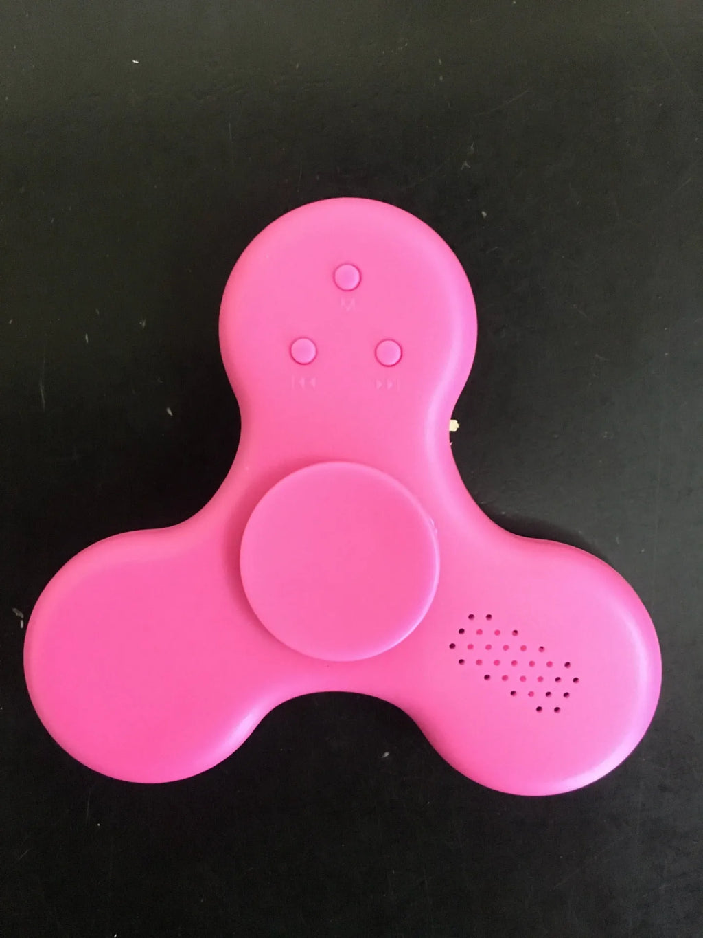 Compact white Bluetooth speaker and MP3 player designed as a fidget spinner toy.