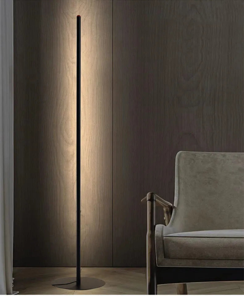 Vertical aluminium alloy floor lamp in modern simple style beside sofa