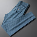 Men's casual linen striped trousers in blue gray, showing elasticated waist and straight leg