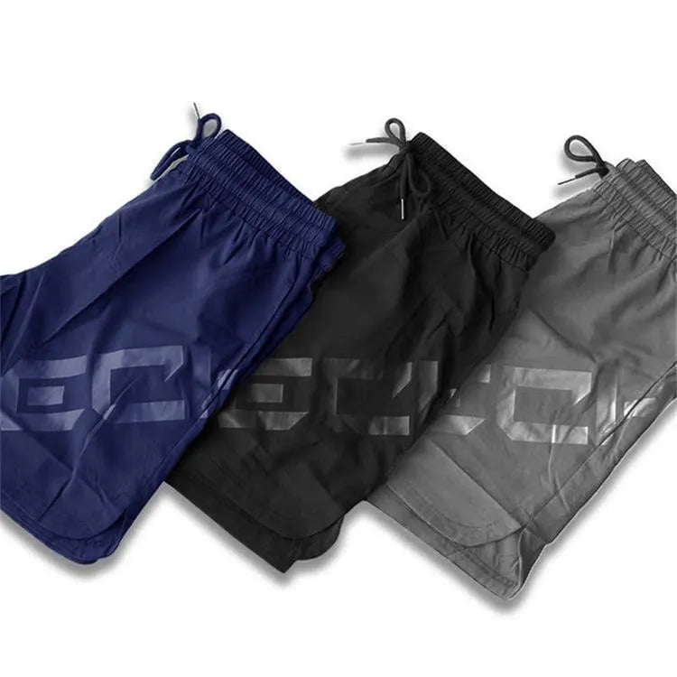 Men's elastic thin quick-dry nylon training shorts in black, available in sizes M to XXL