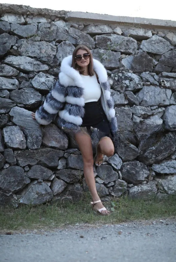 Women's loose-fit artificial fur hooded coat in street fashion style.