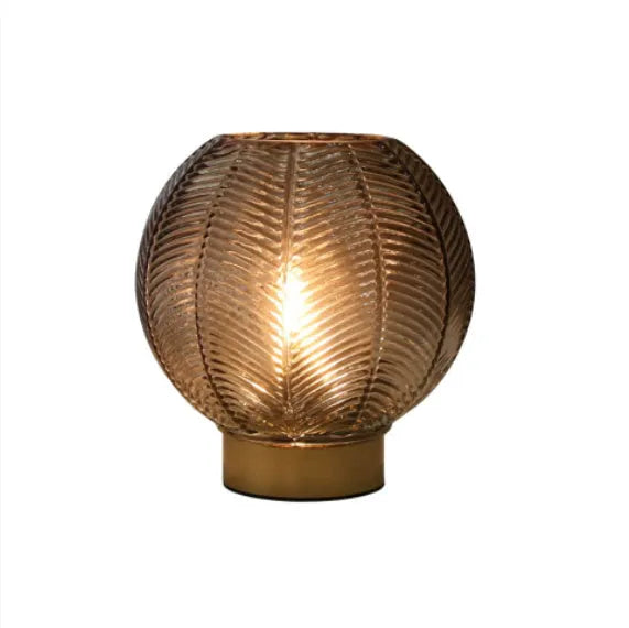 Wireless battery miniature decorative lamp with amber light in geometric stereo modern simplicity design on a tabletop