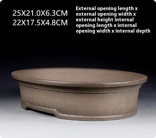 Handmade purple sand ceramic oval bonsai pot measuring 25cm by 21cm