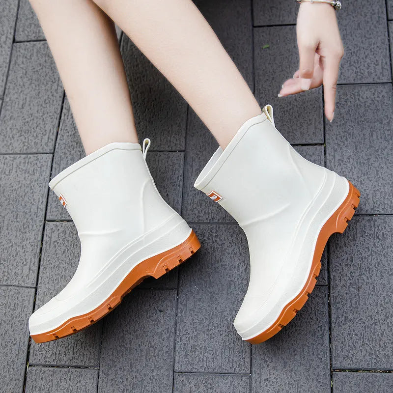 Women's short plastic waterproof rubber shoes in black, shown on a white background.