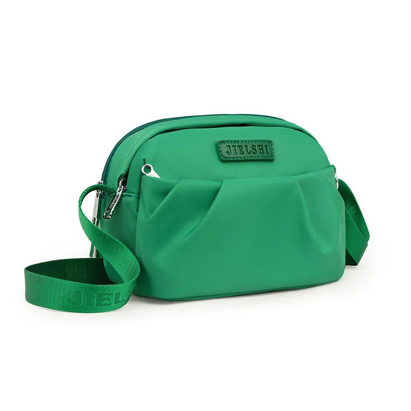 Pleated Oxford cloth shoulder messenger bag in horizontal square shape with crossbody strap