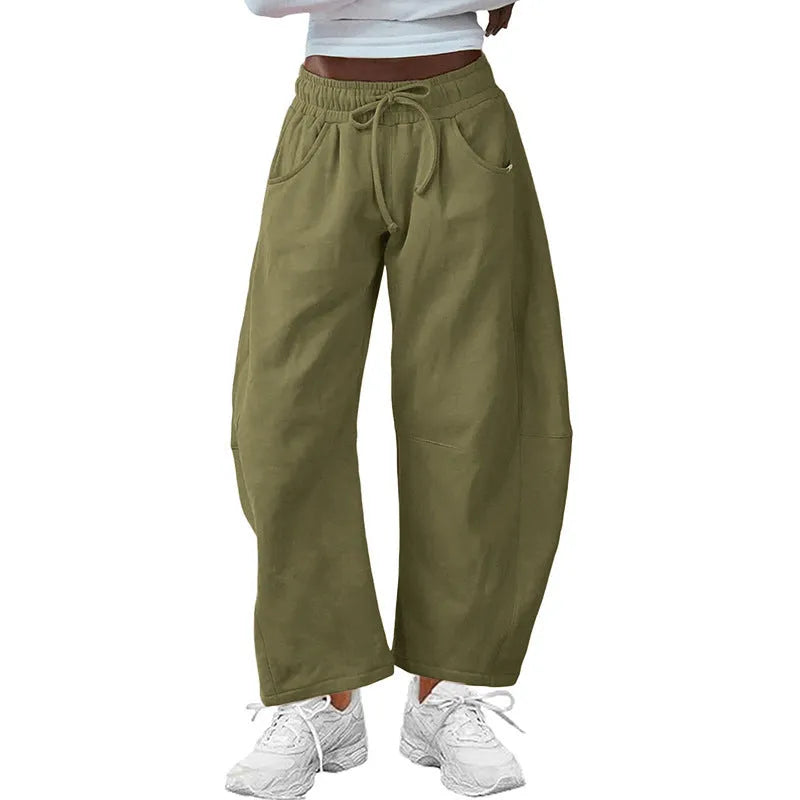 Loose cropped sweatpants with drawstring waist and side pockets in street fashion styling
