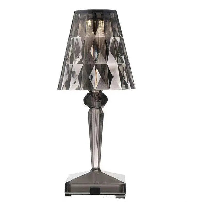 Rose gold plated portable touch night light with rechargeable battery on a table.