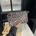 Women's square crossbody bag in PU leather with chain detail, shown in dark brown colour