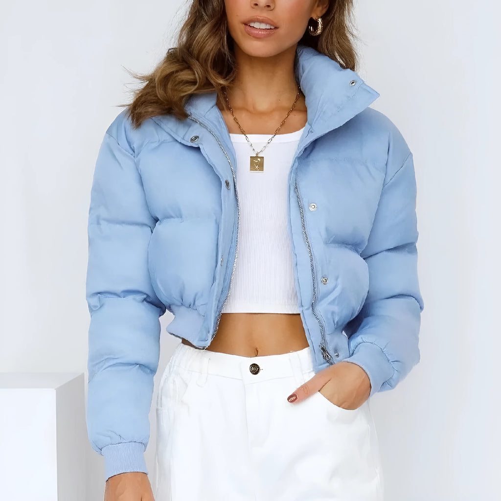 Loose fit blue women's polyester jacket with long sleeves on a hanger