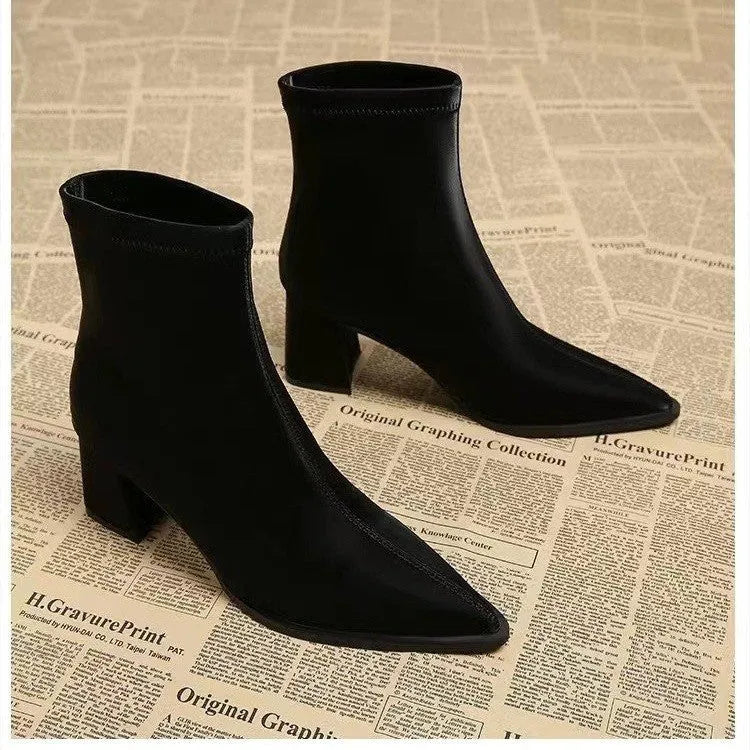 Women's khaki stretch suede pointed-toe ankle boots with a wedge heel on a white background.