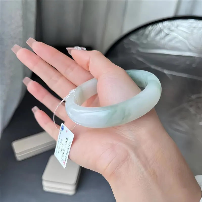Tian Shan Cui jade bracelet with floating flower design and zodiac animal modelling in children's style